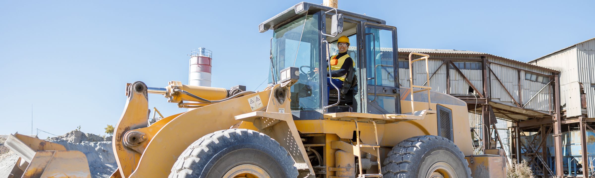 Operator in the cab of a wheel loader